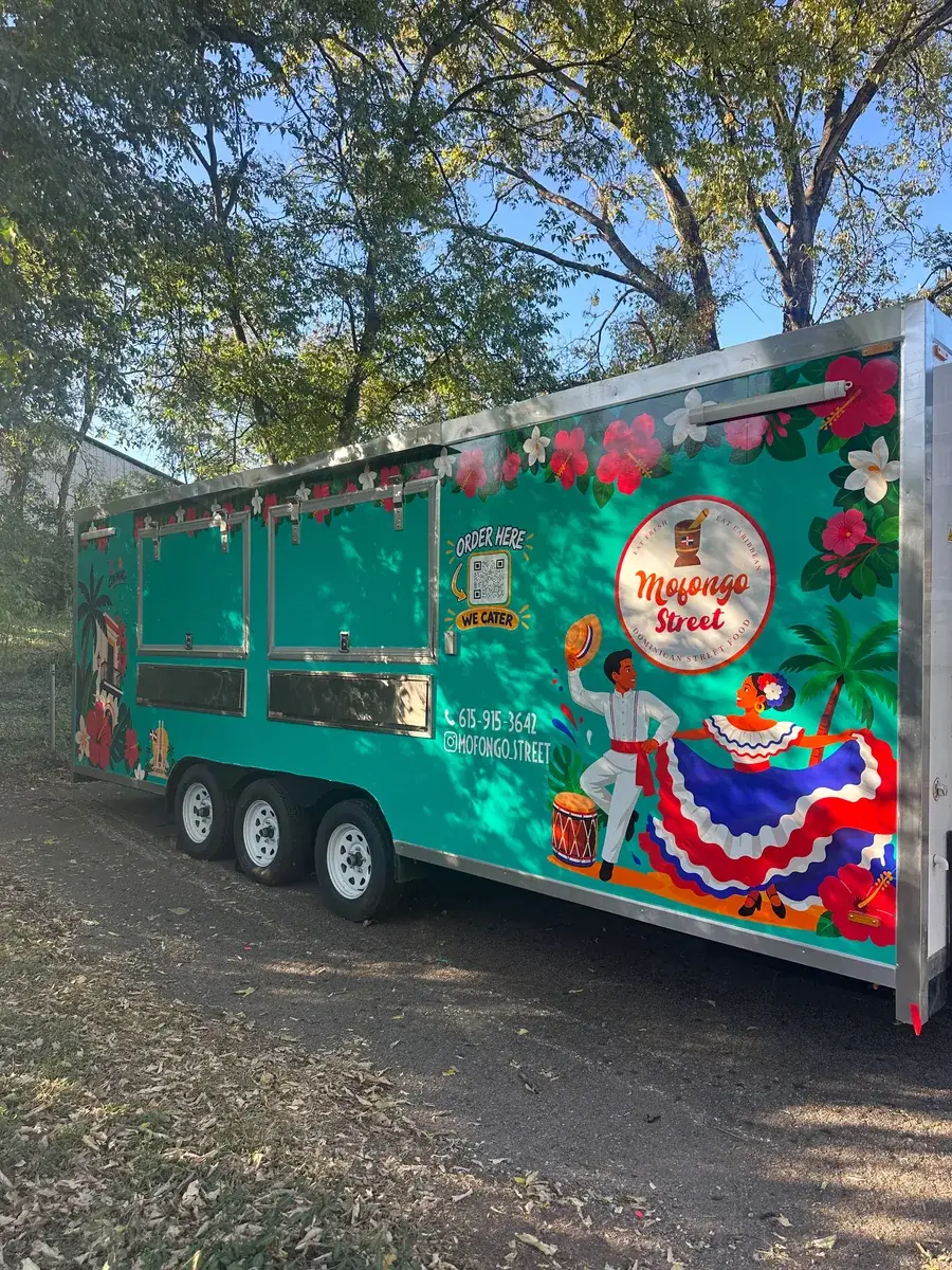 The Mofongo Street food truck parked under the trees